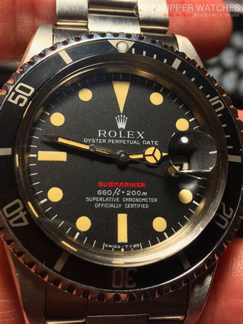 rolex submariner with red letters